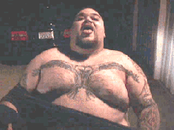 big guy with tattooed chest